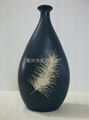 Black ceramic Chinese vase with feather