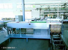 Automatic filled can cage unloading machine