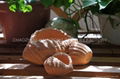 Red terracotta pot with snail design