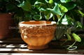 Red terracotta pot with snail design 5