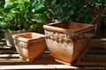 Red terracotta pot with snail design 1