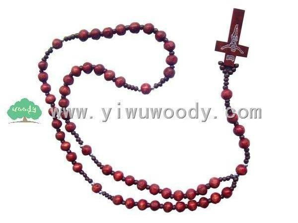 women's rosary beads made of red carved wooden beads