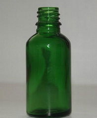 Green essential oil bottle