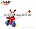 wooden push along toy with beetle