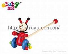 wooden push along toy with beetle