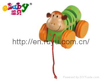 wooden pull along toy with monkey