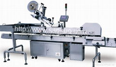 Vertical Feeding/Horizontal Labeling Machine with Bottle-to-tray Inserter