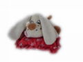 Plush stuffed dog with heart