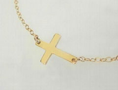 Celebrity jewelry Sideways cross necklace