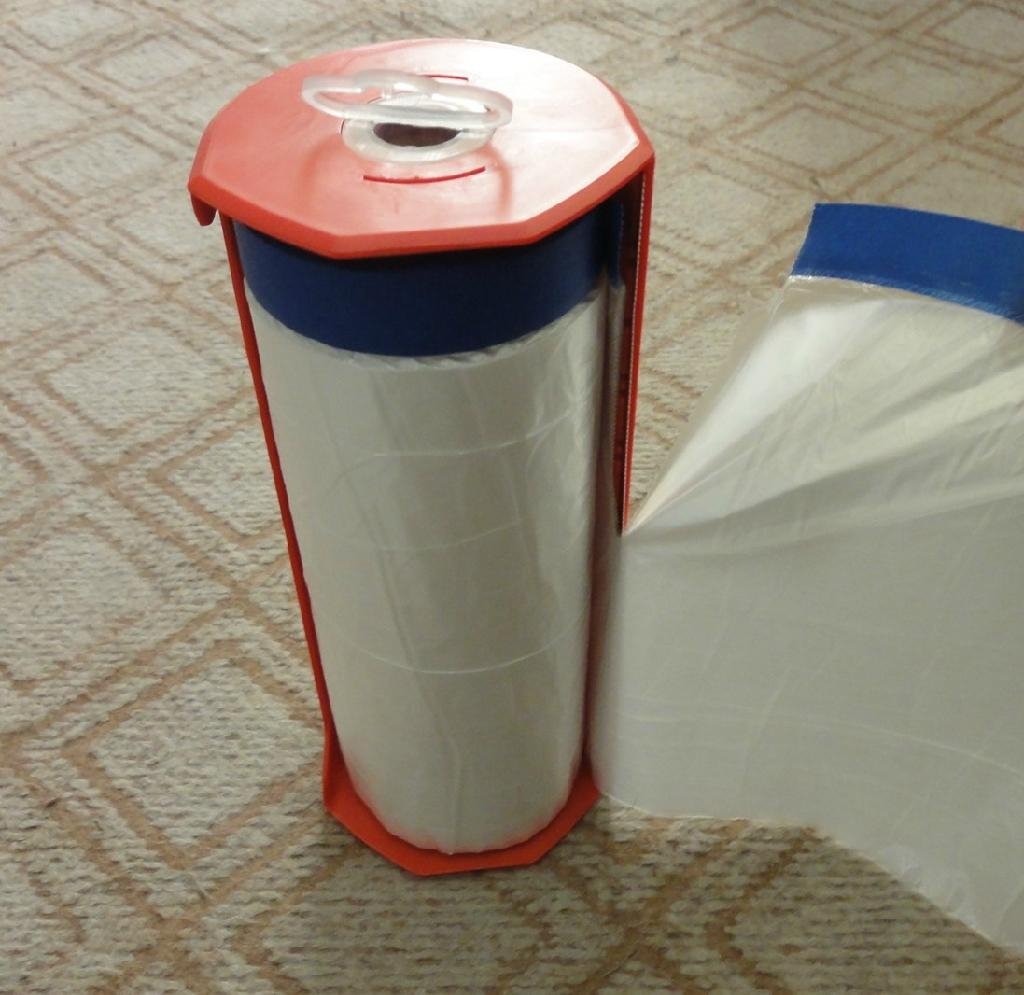 Pre-taped masking film with dispenser 