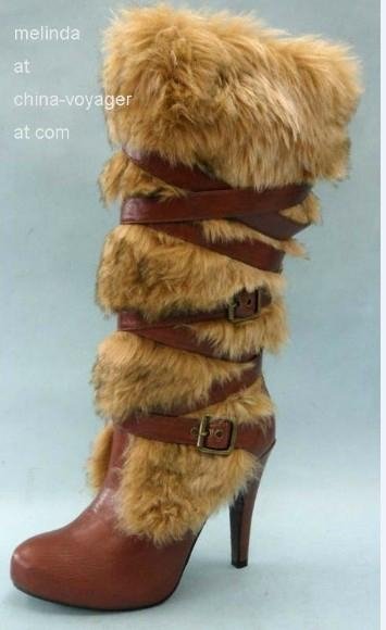 fur knee-high boots with straps across 