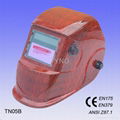 Auto darkening welding mask