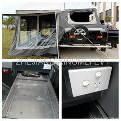 Off road travel trailer with slide tray  for stove and water sink