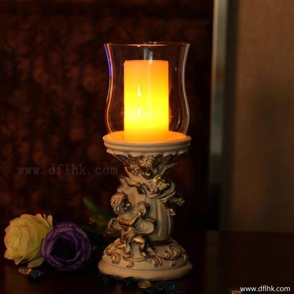 Polyresin angel candle holder with pillar candle