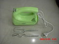 green plastic egg beater 1