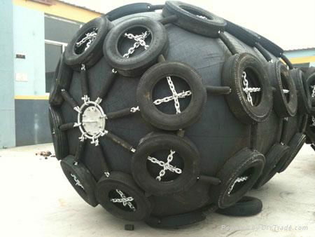 black rubber fender with tire and chain