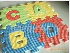 child using eva  alphabet puzzle mat