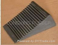 Molded rubber wheel chocks for trucks