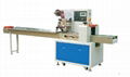 Horizontal flow wrapping machine