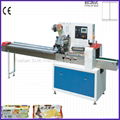 horizontal flow wrapping machine for