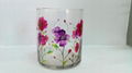 glass candle container with hand
