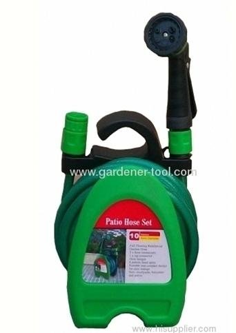 Portable garden hose hanger with hose and nozzle