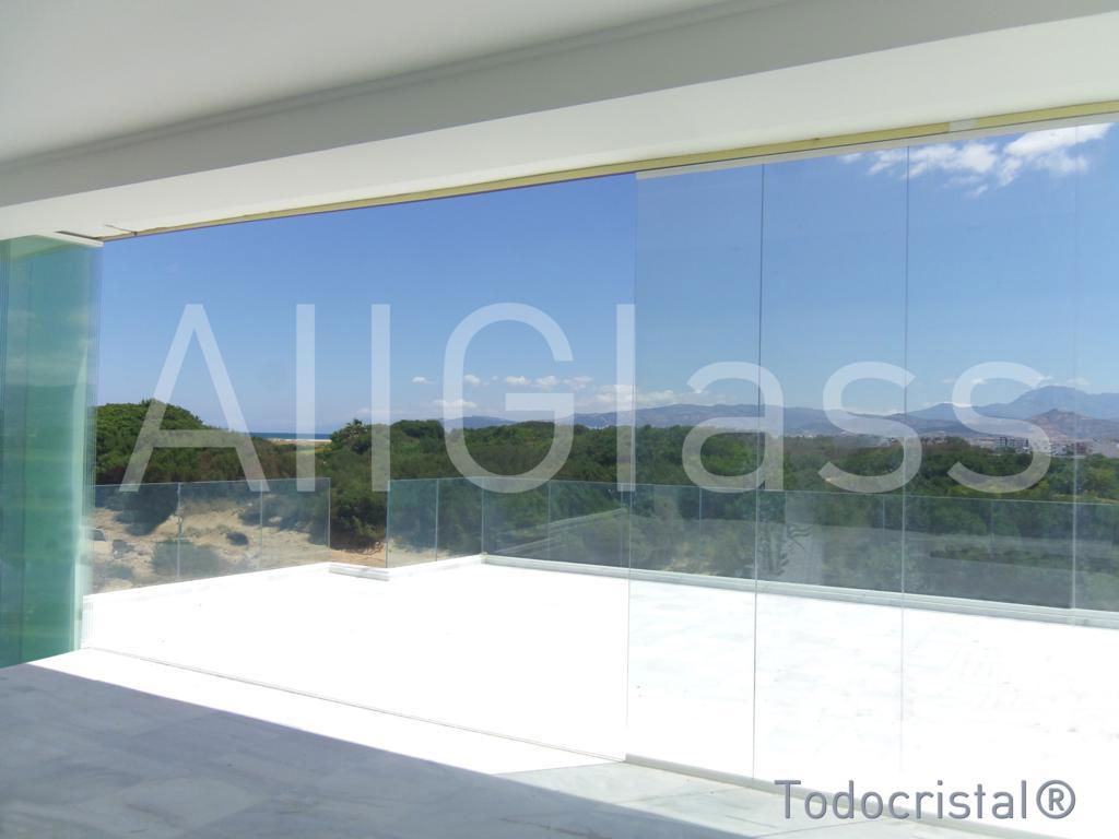 Sliding frameless glazing system 5