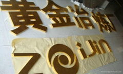 Gold-colored letters