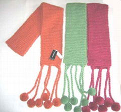 hand-knitted scarf with pompom