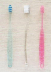 With Transparent and massaging handle adult Toothbrush