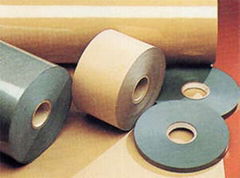 Insulating paper/polyester film laminate composite