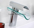 brass waterfall faucet with clear glass