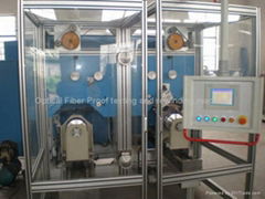 Optical fiber proof-testing and rewinding machine