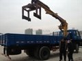 folded boom truck crane with brick grab 2