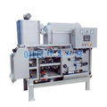 Sludge dehydrating belt filter press for