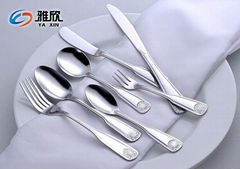 delicate stainless steel flatware with shell pattern