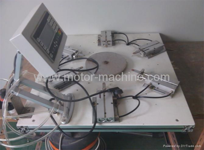 Induction cooker magnet stick inserting machine