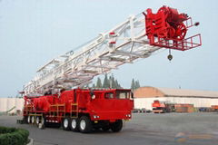 Truck mounted land drilling rig