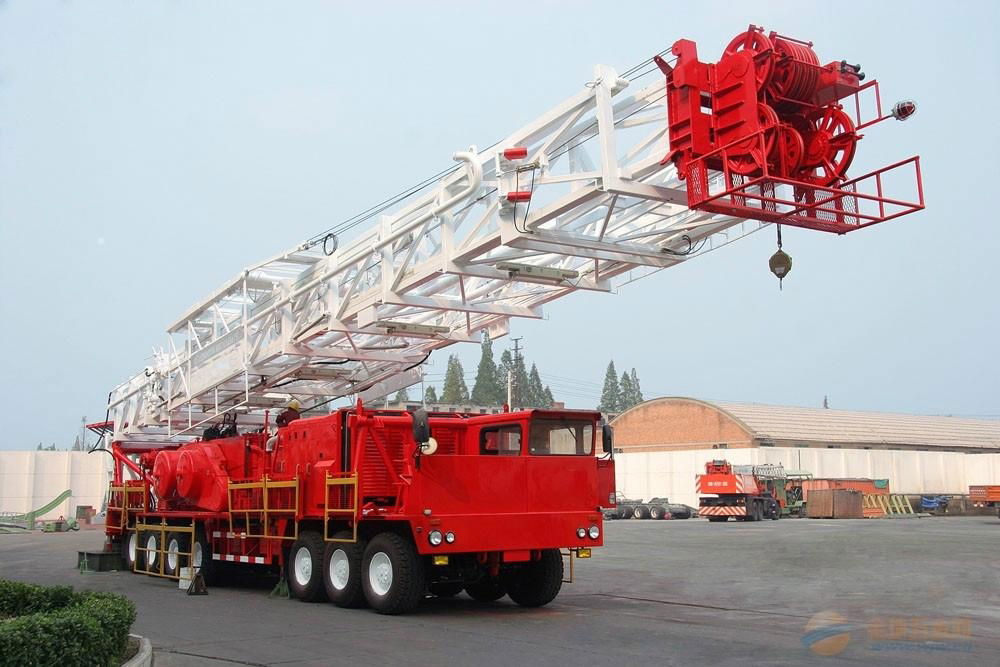 Truck mounted land drilling rig