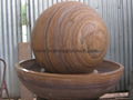 Rainbow sandstone sphere and Granite trio