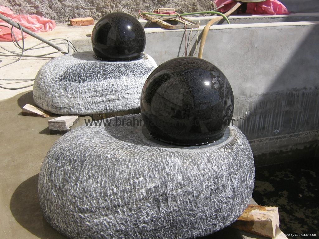 floating ball in black granite