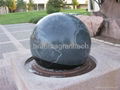 Rolling globe fountains, granite water