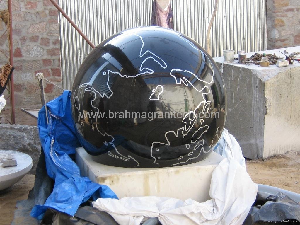 black marble ball with gray rock base 3