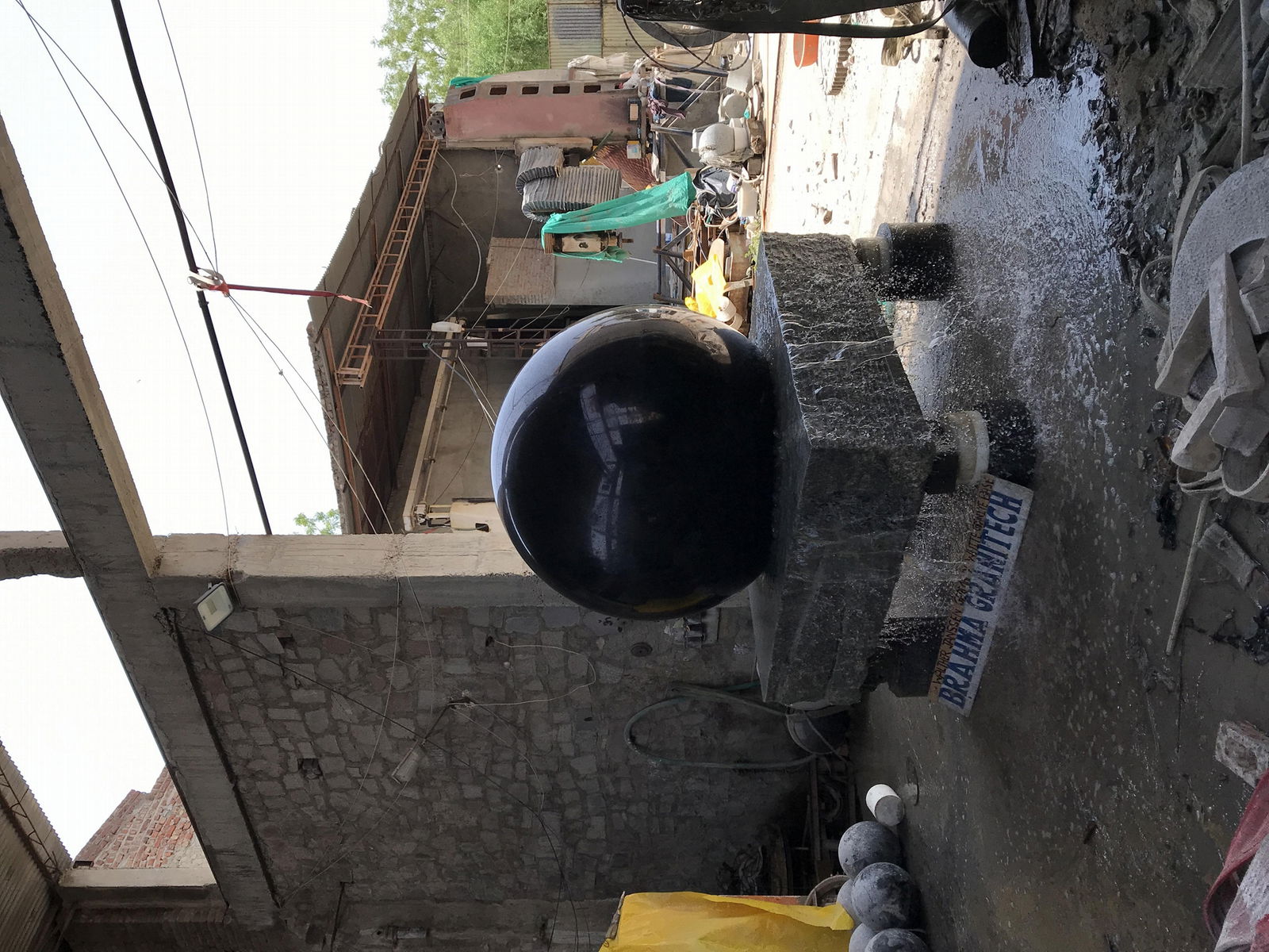 spinning ball, rotating globe, stone sphere, rock ball, black granite sphere