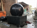 Gray granite Sphere with on rock solid