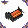 Automobile headlight lens electromagnet