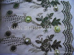 embroidered with handwork on mesh