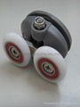 Shower cabin roller with swing double wheel