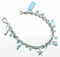 Metal Bracelet With Shiny Charms and Logo
