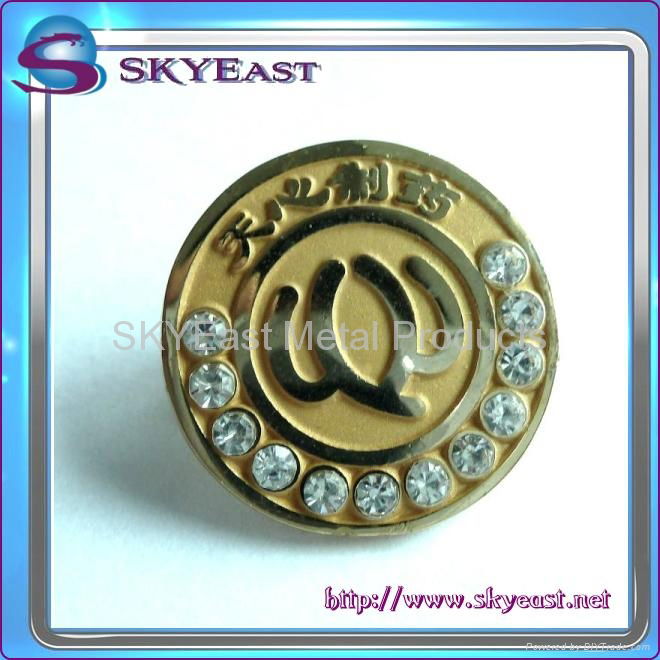 Gold metal pin badge with rhinestones